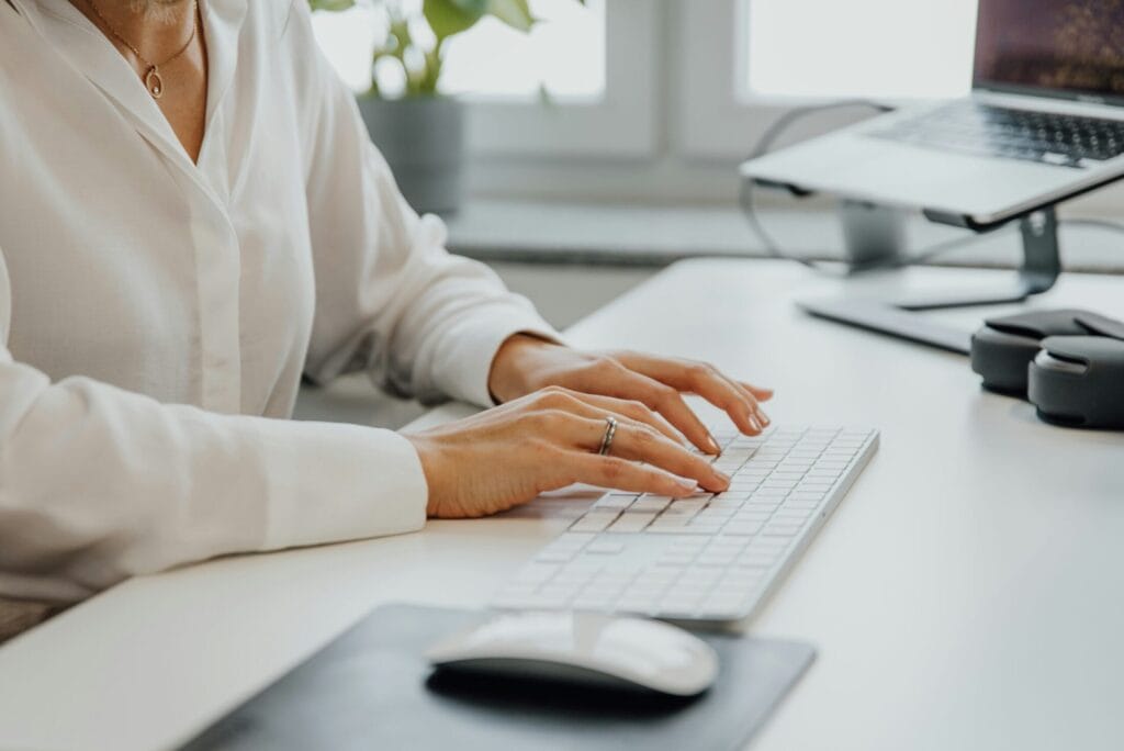 Woman on laptop performing SEO services for clients